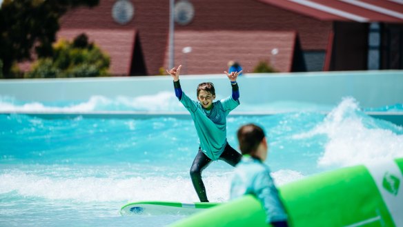 Kids hit the waves at URBNSURF.