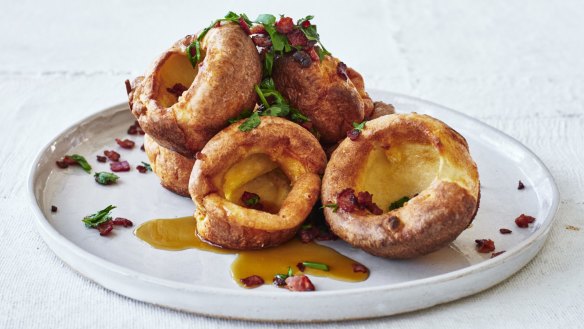 Popover yorkies with sizzling bacon and maple syup.