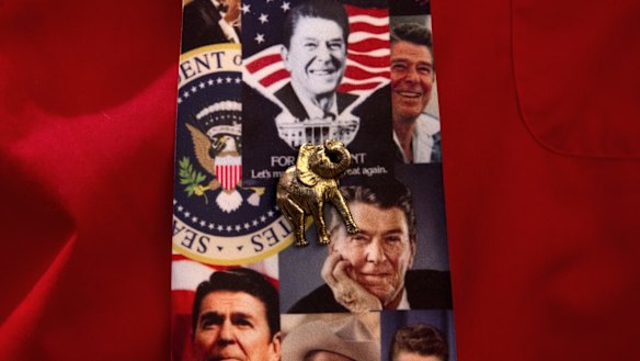 An attendee wears a tie featuring former US president Ronald Reagan and an elephant pin during a primary night rally for Republican presidential candidate Senator Marco Rubio, in Manchester, New Hampshire.