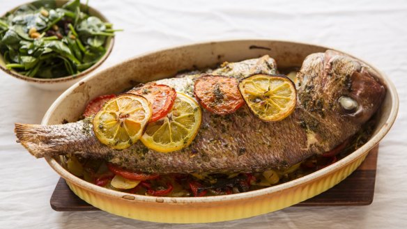 Whole baked snapper with Catalan-style wilted spinach. 