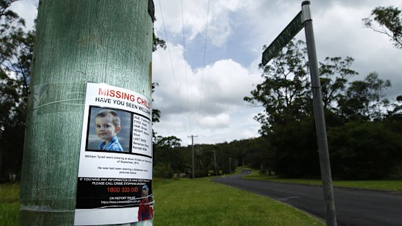 A poster on a telegraph pole at the start of Benaroon Drive, Kendall asking for information about missing toddler William Tyrrell.