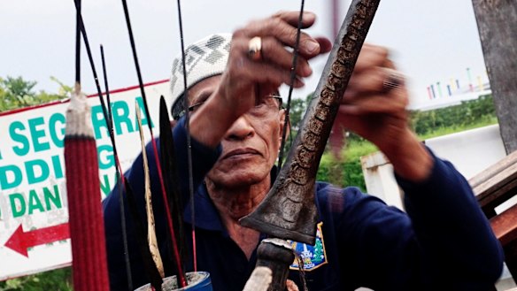 Muslimin Suparman has been a pawang hujan since 1973. 