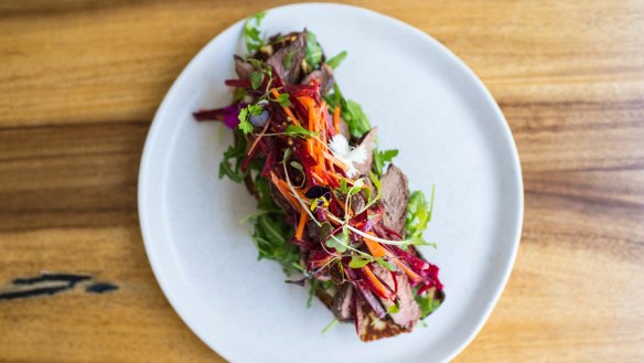 Lamb and haloumi open rye with beetroot slaw.