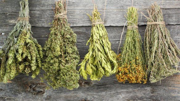 Hang bunches of fresh herbs upside in a sunny spot to dry them for future use. 