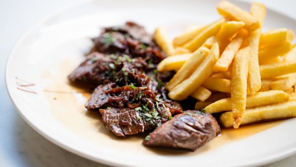 Steak frites with shallot jus and crisp, golden frites. 