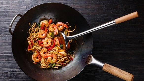 Season a cast-iron wok well and it becomes non-stick.