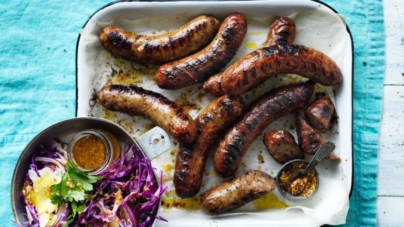 Barbecued sausages with red cabbage and mustard salad.