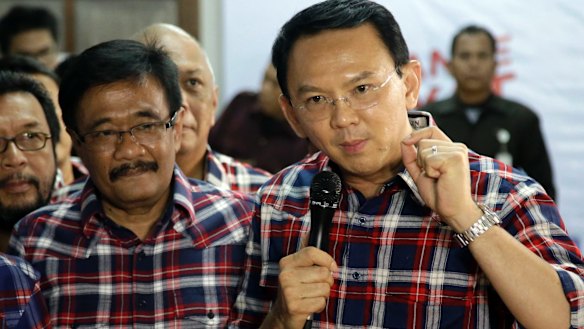 Under pressure: Ahok, right, with his gubernatorial running mate Djarot Saiful Hidayat, a Muslim, in Jakarta last month.  