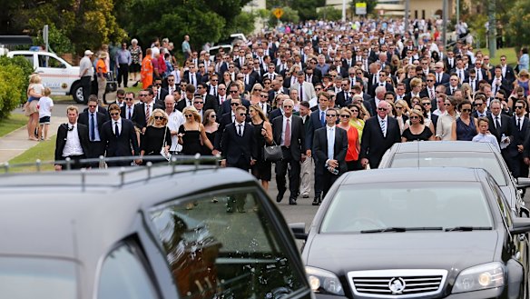 The funeral procession through the streets of Macksville. 