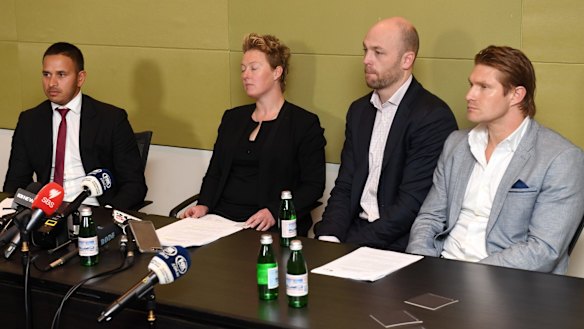 Cool relations: Usman Khawaja, ACA staff members Clea Smith and Alistair Nicholson, and Shane Watson listen to questions at a press conference following the emergency executive meeting in Sydney on Sunday.