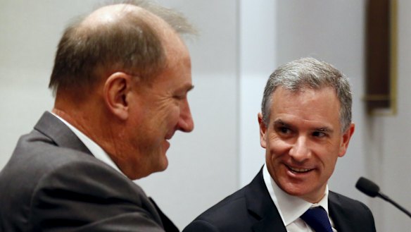 Brookfield Infrastructure chief executive Sam Pollock, right, smiles as he speaks with Asciano CEO John Mullen on Tuesday.