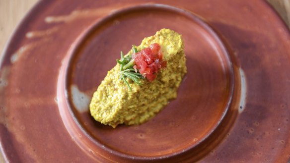 Kingfish in turmeric, mustard and coconut sauce with sea succulents and blood lime.