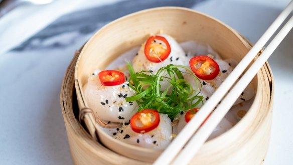 Steamed scallop har gow in steamer.