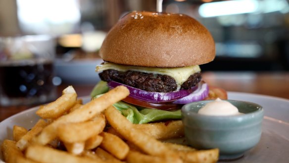 To make the beef burger, the patty is rubbed with coffee grounds before cooking, giving it bright smokiness. 