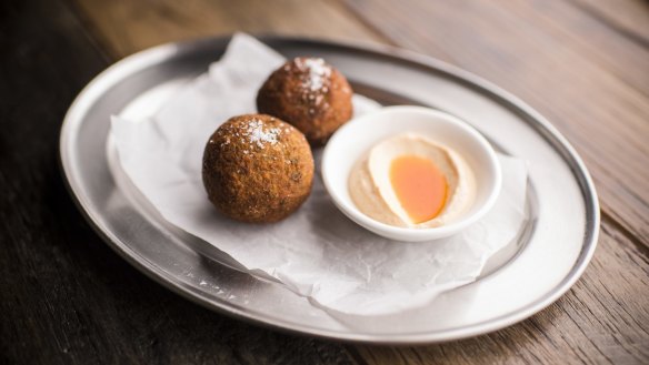 Arancini, deep-fried risotto balls loaded with parsley and lemon zest.