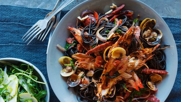 Squid ink pasta with vongole, chorizo and roasted prawn oil, and a pear, parmesan and rocket salad on the side.