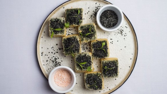 Tofu with black sesame seeds.