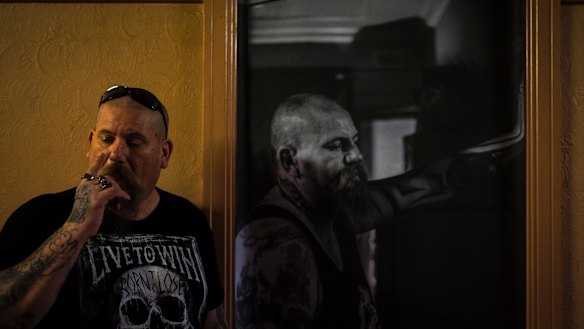 Troy Matthews, a resident of the Gatwick for six months, with his portrait.