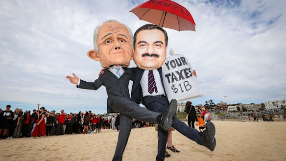 Protesters dressed as Malcolm Turnbull and Gautam Adani at Bondi Beach on Saturday.