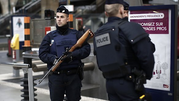 French police officers patrol the platforms at the Gare du Nord train station in Paris, France on Saturday.