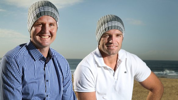 Worthy cause: Mark Hughes and Danny Buderus don their headgear in Newcastle ahead of the NRL's Beanies for Brain Cancer round.