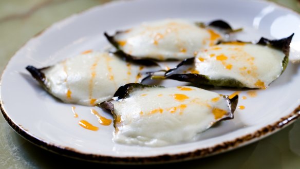 Baked mozzarella in lemon leaves.