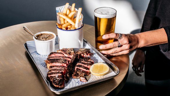 New shine: Black Angus T-bone with diane sauce and chips.