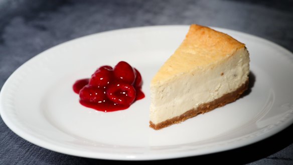 Cheesecake with poached raspberries. 