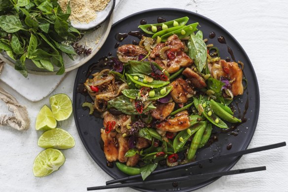 Spicy stir-fried pork belly with Thai basil and sugar snap peas.