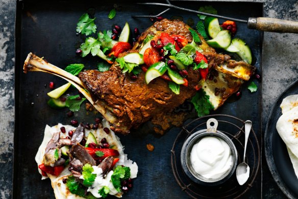 Lamb shoulder with tahini yoghurt, pickled cucumbers, pomegranate and herbs.