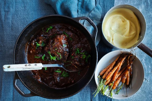 Braised beef cheeks with carrots and parsnip puree.