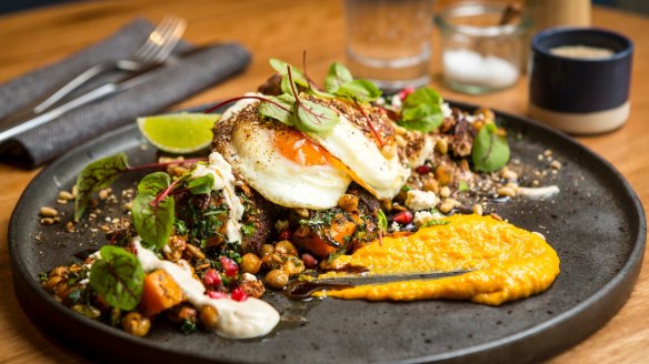 Middle Eastern lamb, pumpkin and chickpea fry-up with fried eggs, hummus and zaatar at Plain Sailing.