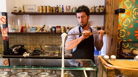 Harun Yalcin stretching Turkish ice-cream at his cafe Cuppa Turca in Northcote.  