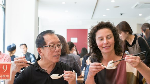 Tony Tan and Dani Valent eat xiao long bao dumplings at Shanghai Street.