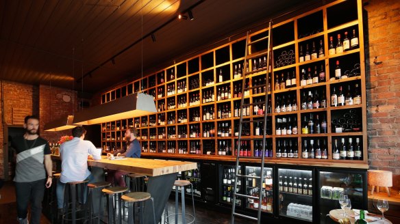 The wine bottle wall at The Alps in Prahran.