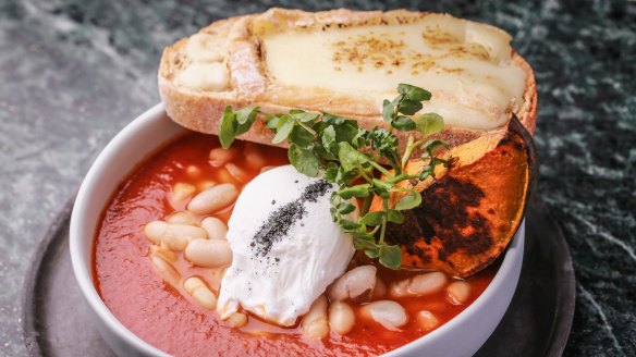 The wood-fired beans, pumpkin and cheesy toast served at Abacus cafe in South Yarra. 