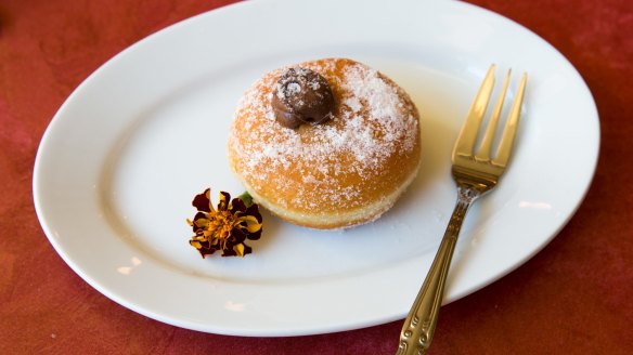 Sugar-dusted bombolini (doughnut).