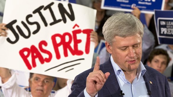 Canadian Prime Minister Stephen Harper at a rally in Montreal on Sunday. The sign reads: "Justin (Trudeau) not ready". 
