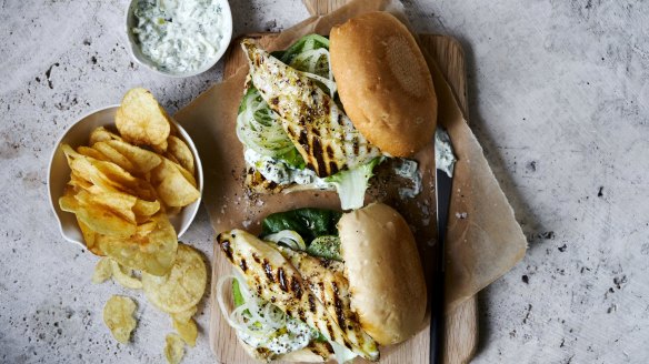 Barbecue fish burgers with potato chips. 