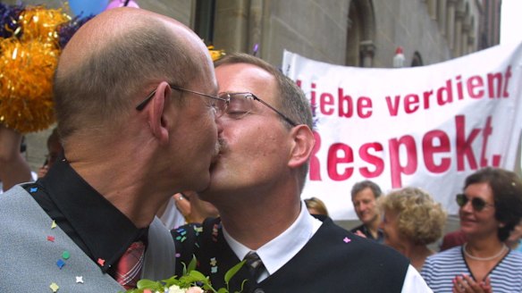 File image showing German couple Heinz Friedrich Harre and Reinhard Luechow in front of a registry office in Hanover, in 2001.