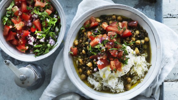 Chickpea and green lentil curry served with chopped tomatoes and coriander.