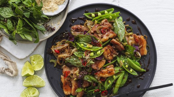 Spicy stir-fried pork belly with Thai basil and sugar snap peas.