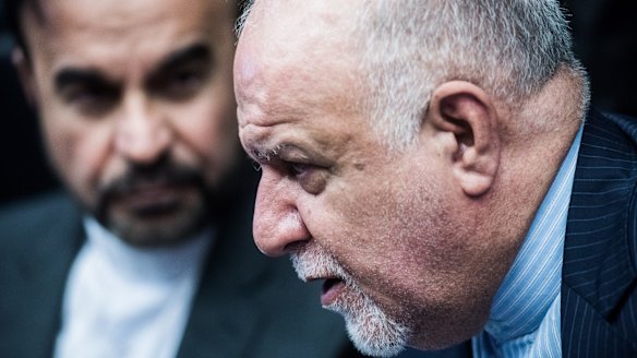 Bijan Zanganeh, Iran's oil minister, right, speaks to journalists ahead of an OPEC meeting in Vienna in June.