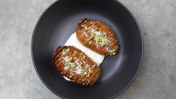 Hasselback potatoes roasted with beef fat and served with labne.
