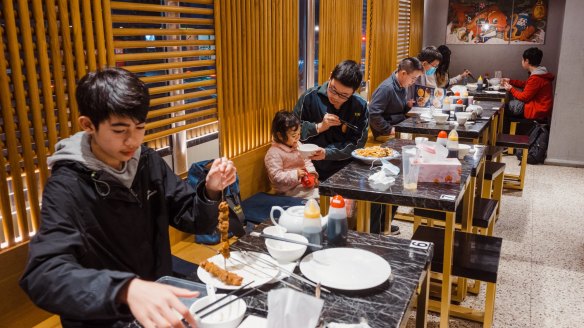 There are no grapes hanging from the ceiling at the new Chinese Noodle Restaurant.