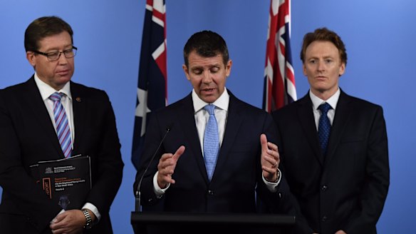 Greyhound ban: NSW Premier Mike Baird, centre, Deputy Premier Troy Grant, left, and CEO of RSPCA NSW Steve Coleman at the announcement on Thursday.