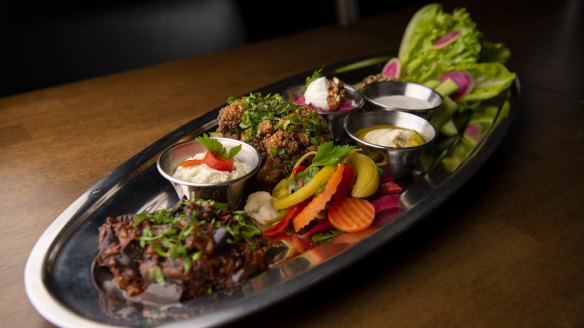 The metre-long vegie platter barely fits on the table.