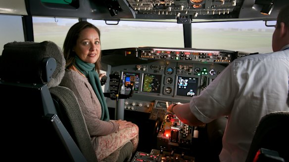 Mastering the fear: Eliza Strauss in a flight simulator with flight instructor Tom Dyke at Flight Experience. 