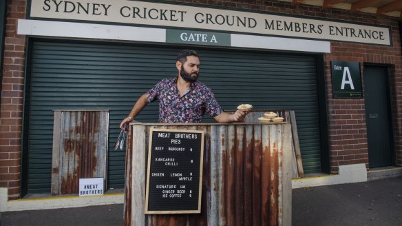 Gamilaraay man Corey Grech selling kangaroo pies outside Sydney Cricket Ground.