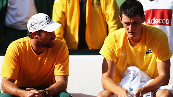 Bernard Tomic and Pat Rafter of Australia at a Davis Cup tie against Germany in 2012.